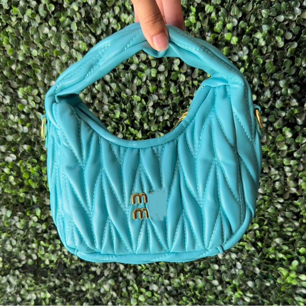 New teal and gold fashion handbag